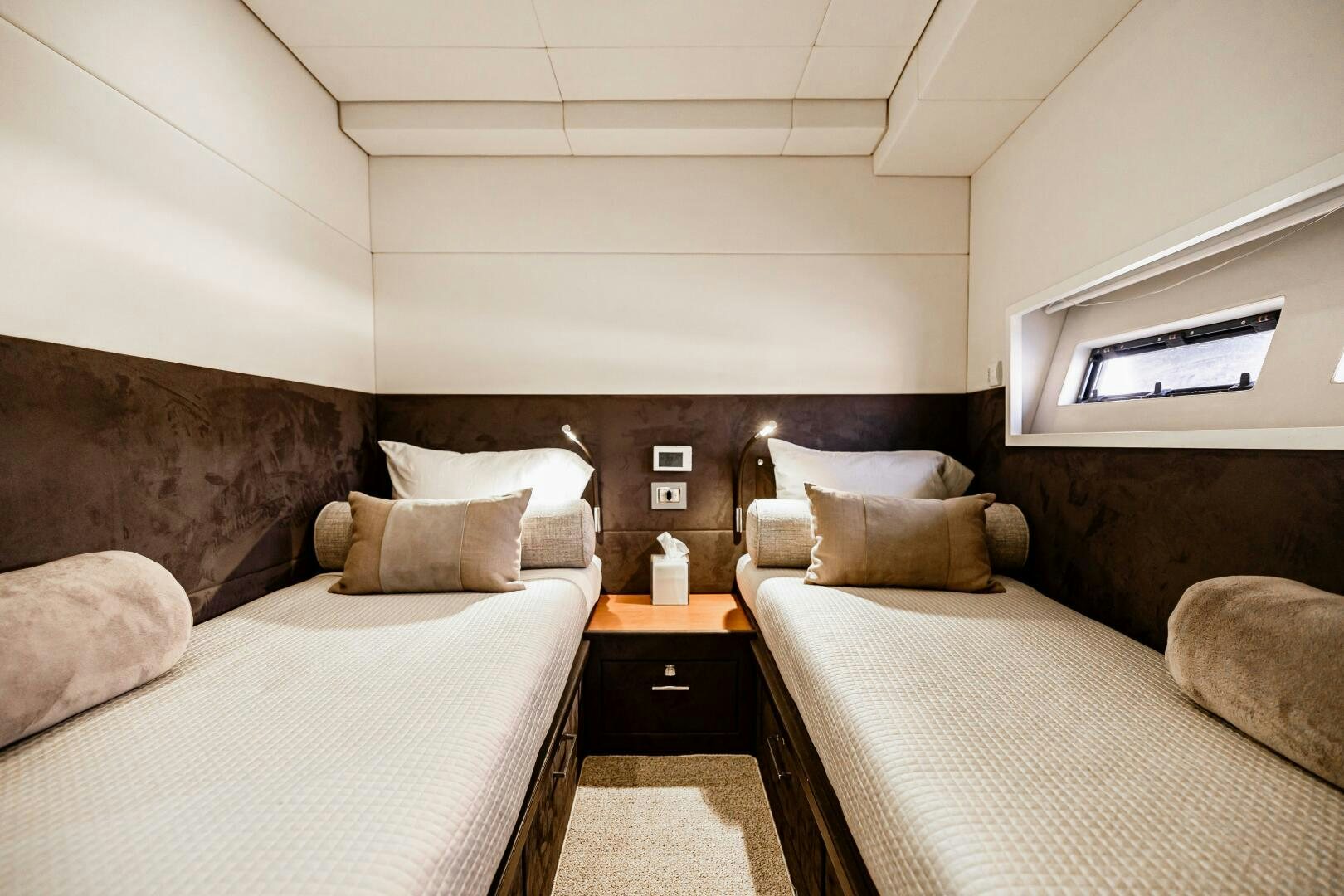 a room with two beds aboard VELOCE II Yacht for Sale