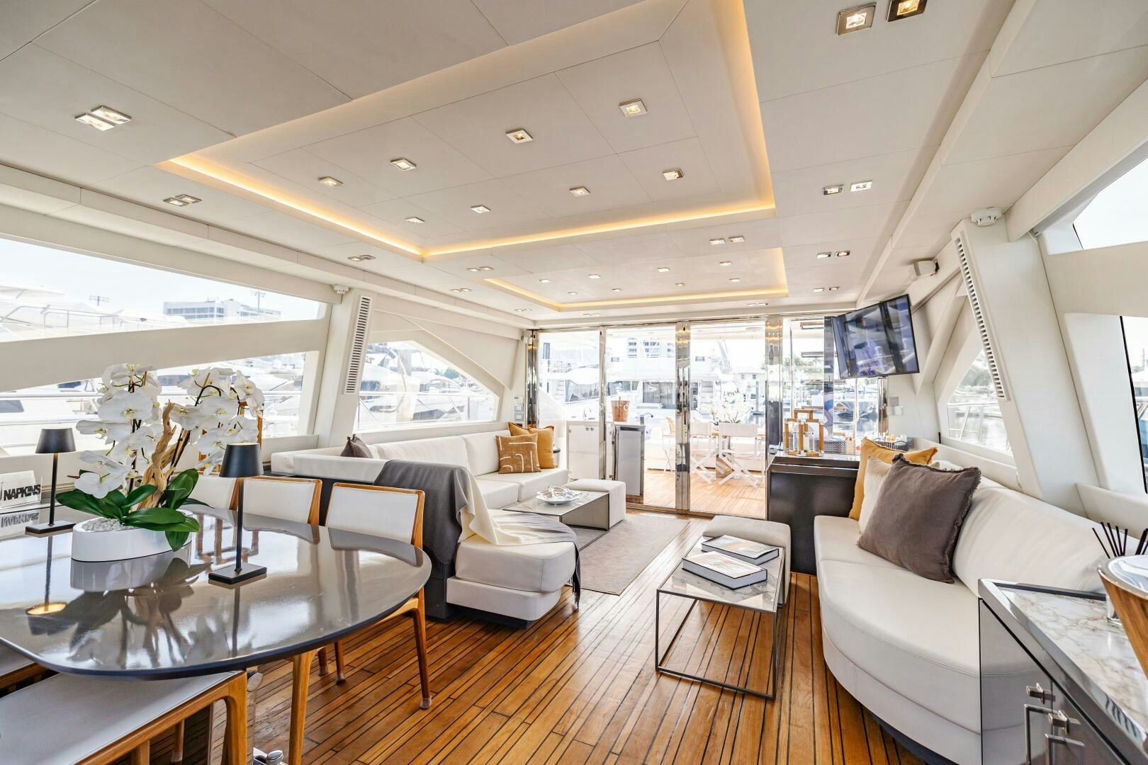 a living room with a wood floor aboard VELOCE II Yacht for Sale