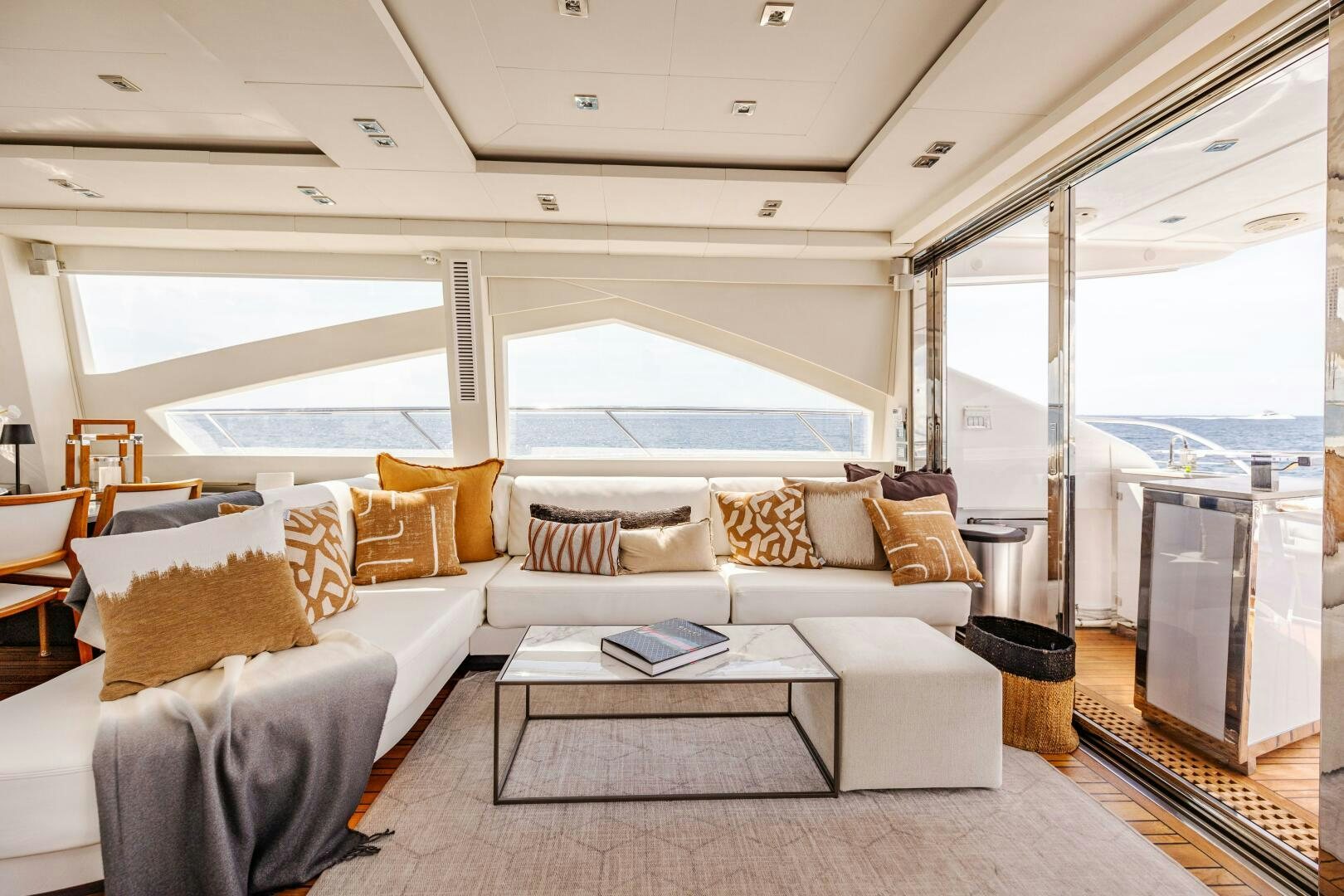 a living room with a large window aboard VELOCE II Yacht for Sale