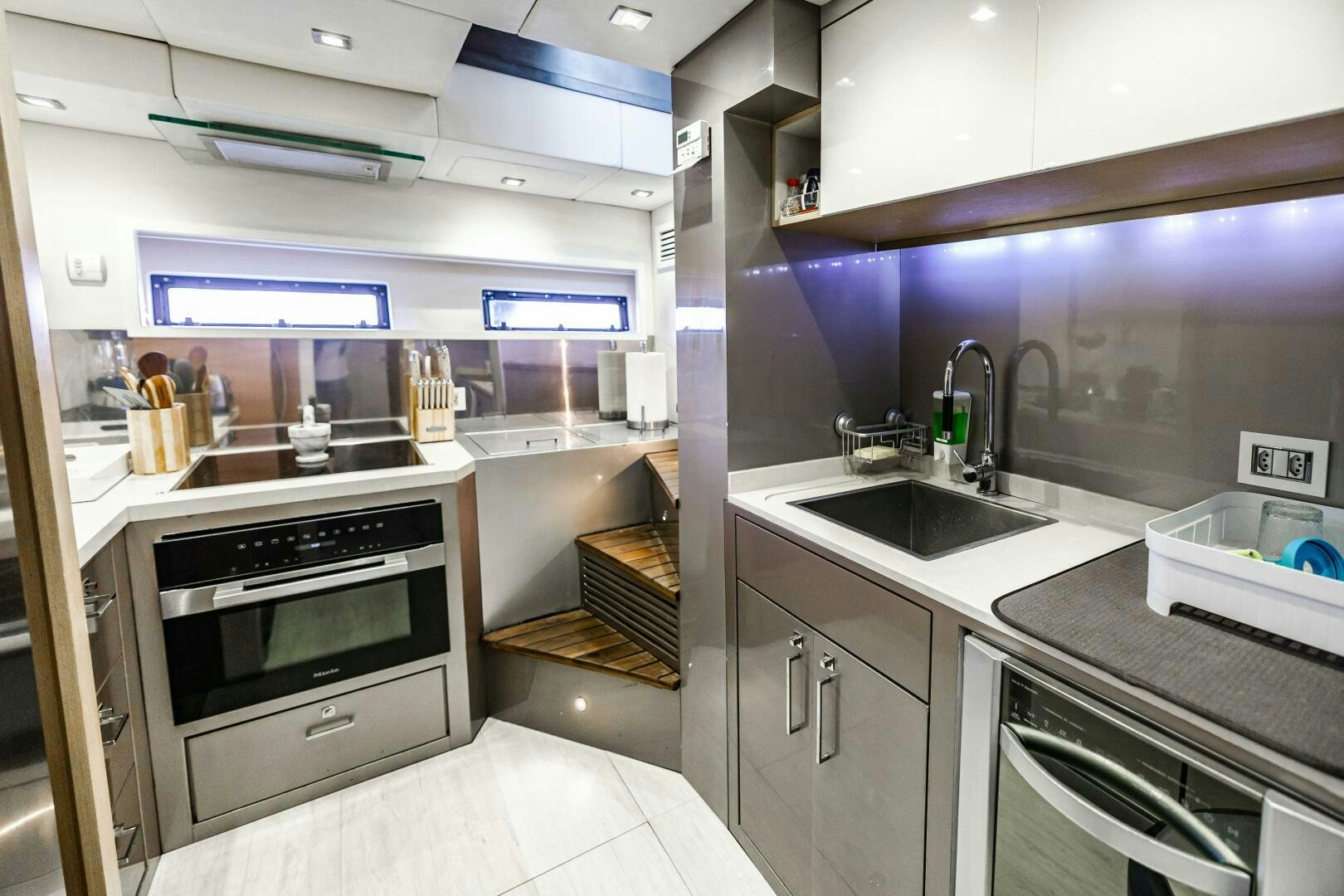 a kitchen with a stove and sink aboard VELOCE II Yacht for Sale