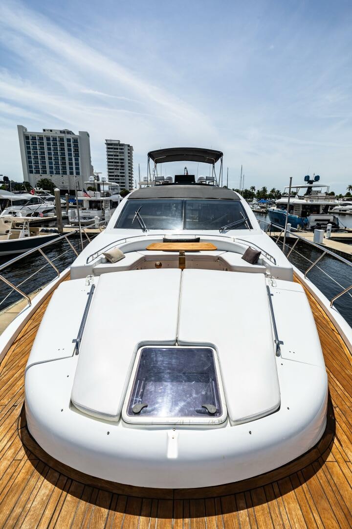 a white car parked in a dock aboard VELOCE II Yacht for Sale