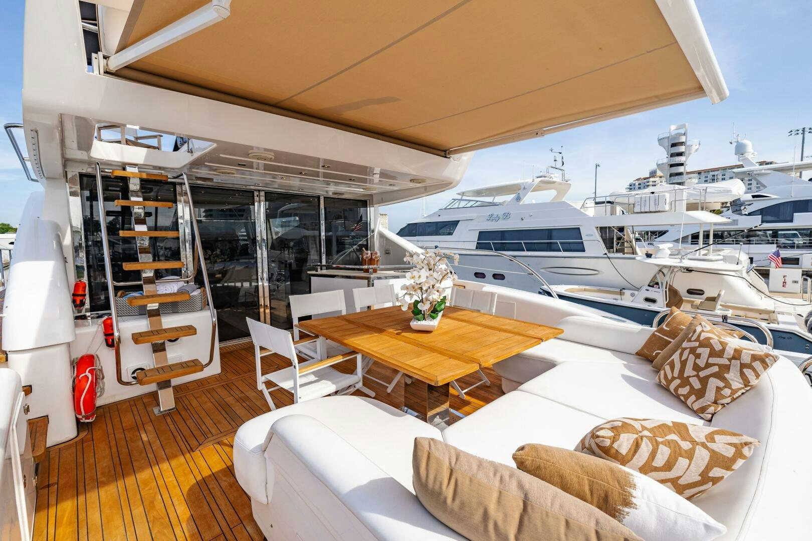 a room with a table and chairs aboard VELOCE II Yacht for Sale