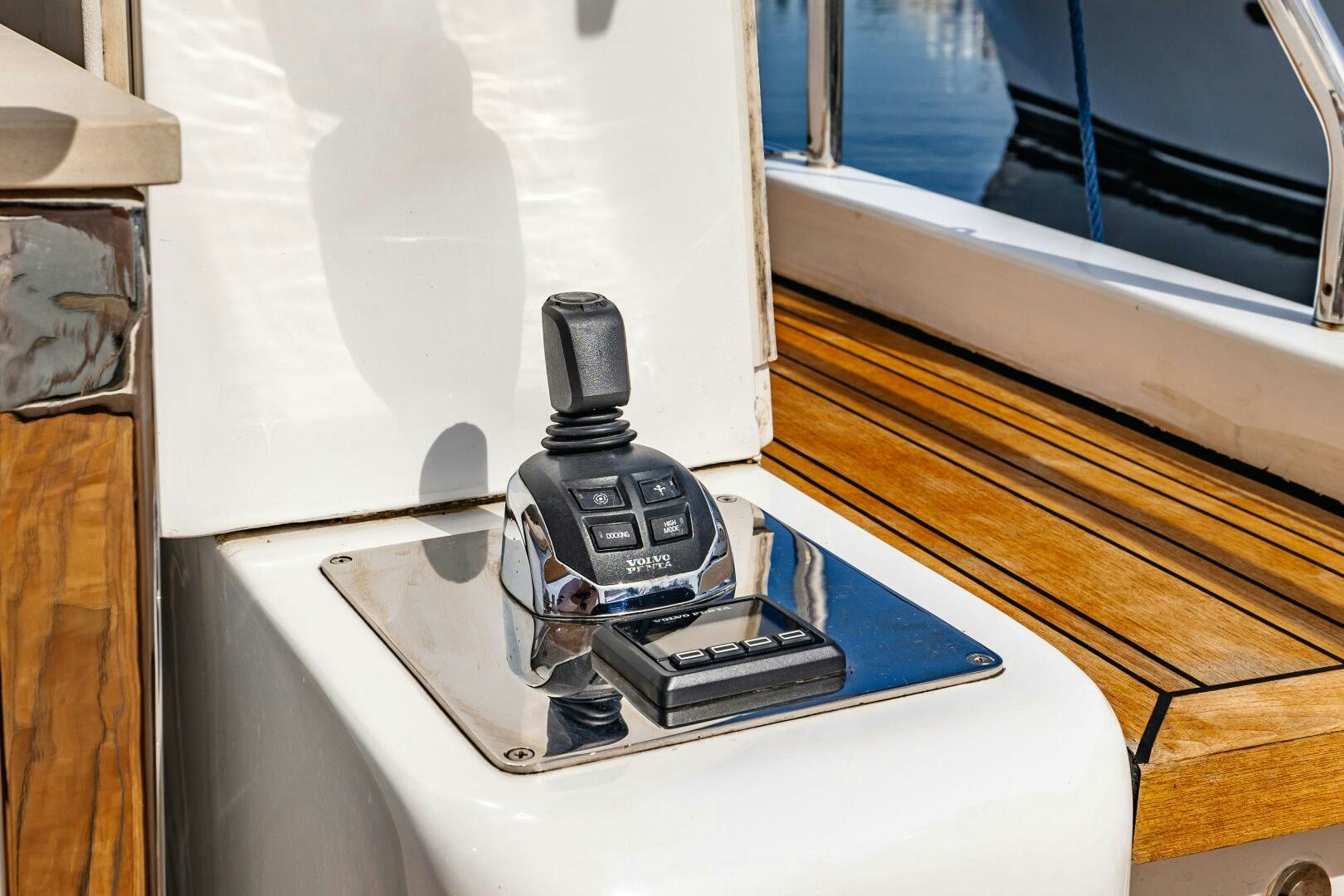 a black and silver telephone on a white table aboard VELOCE II Yacht for Sale