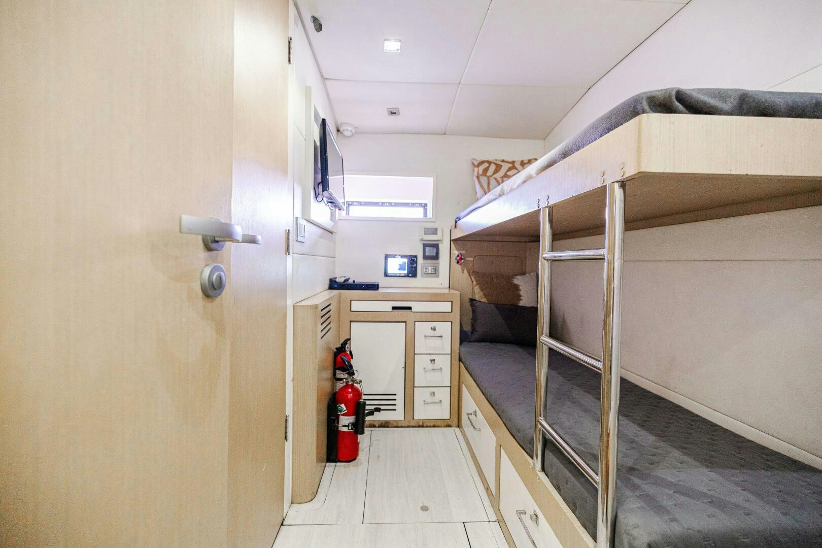 a room with bunk beds aboard VELOCE II Yacht for Sale