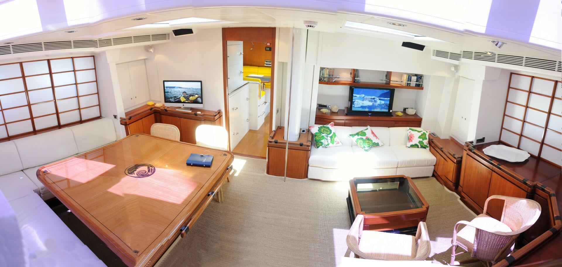 a living room with a couch and a television aboard BILLY BUDD Yacht for Sale