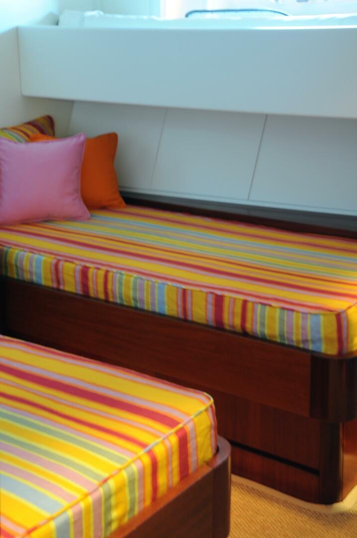 a bed with a colorful comforter aboard BILLY BUDD Yacht for Sale