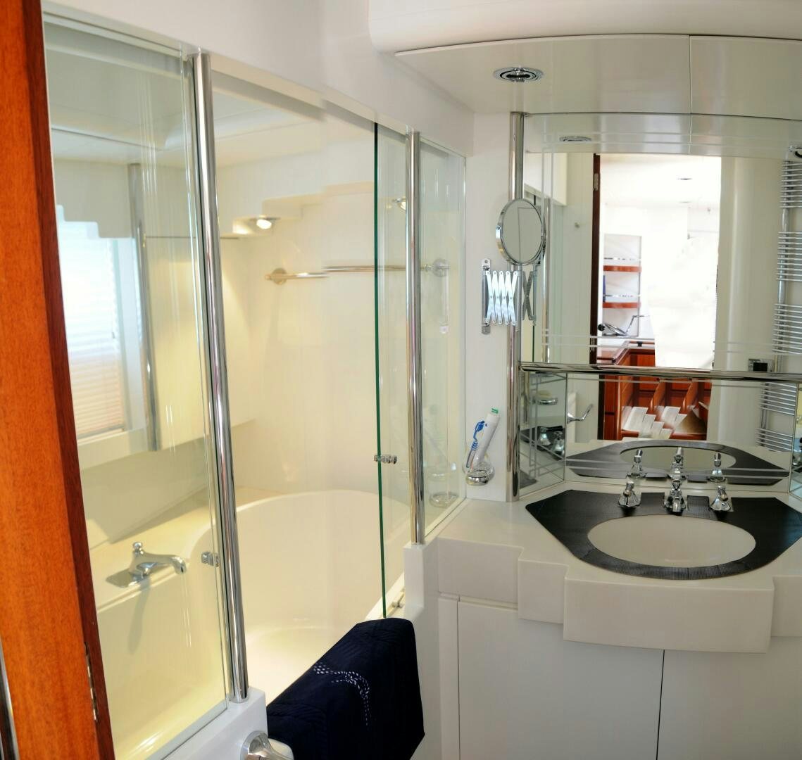 a bathroom with a large mirror aboard BILLY BUDD Yacht for Sale