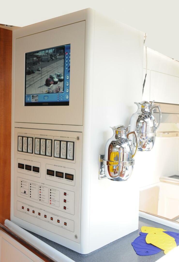 a white machine with a picture on the wall aboard BILLY BUDD Yacht for Sale