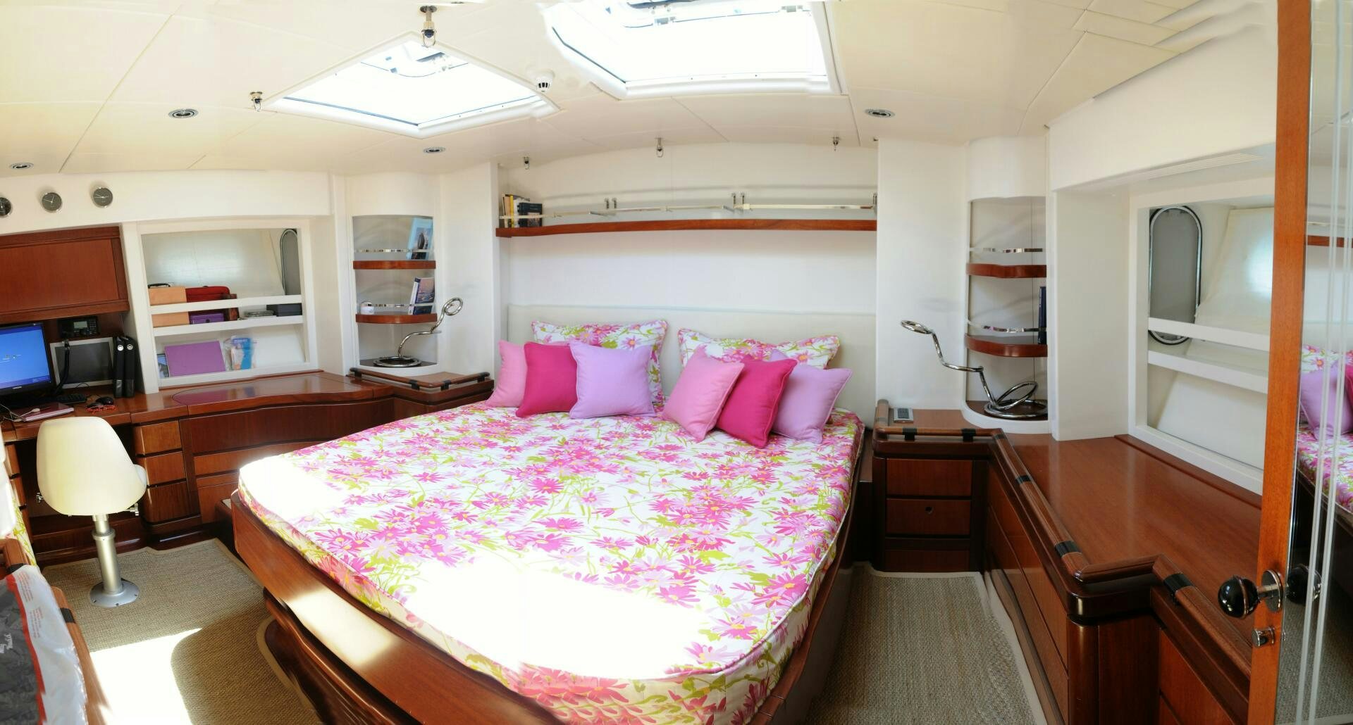 a bedroom with a bed and a desk aboard BILLY BUDD Yacht for Sale