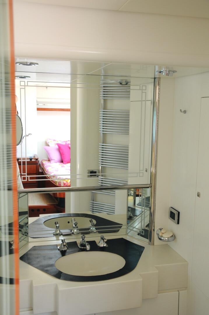 a bathroom with a sink and a mirror aboard BILLY BUDD Yacht for Sale
