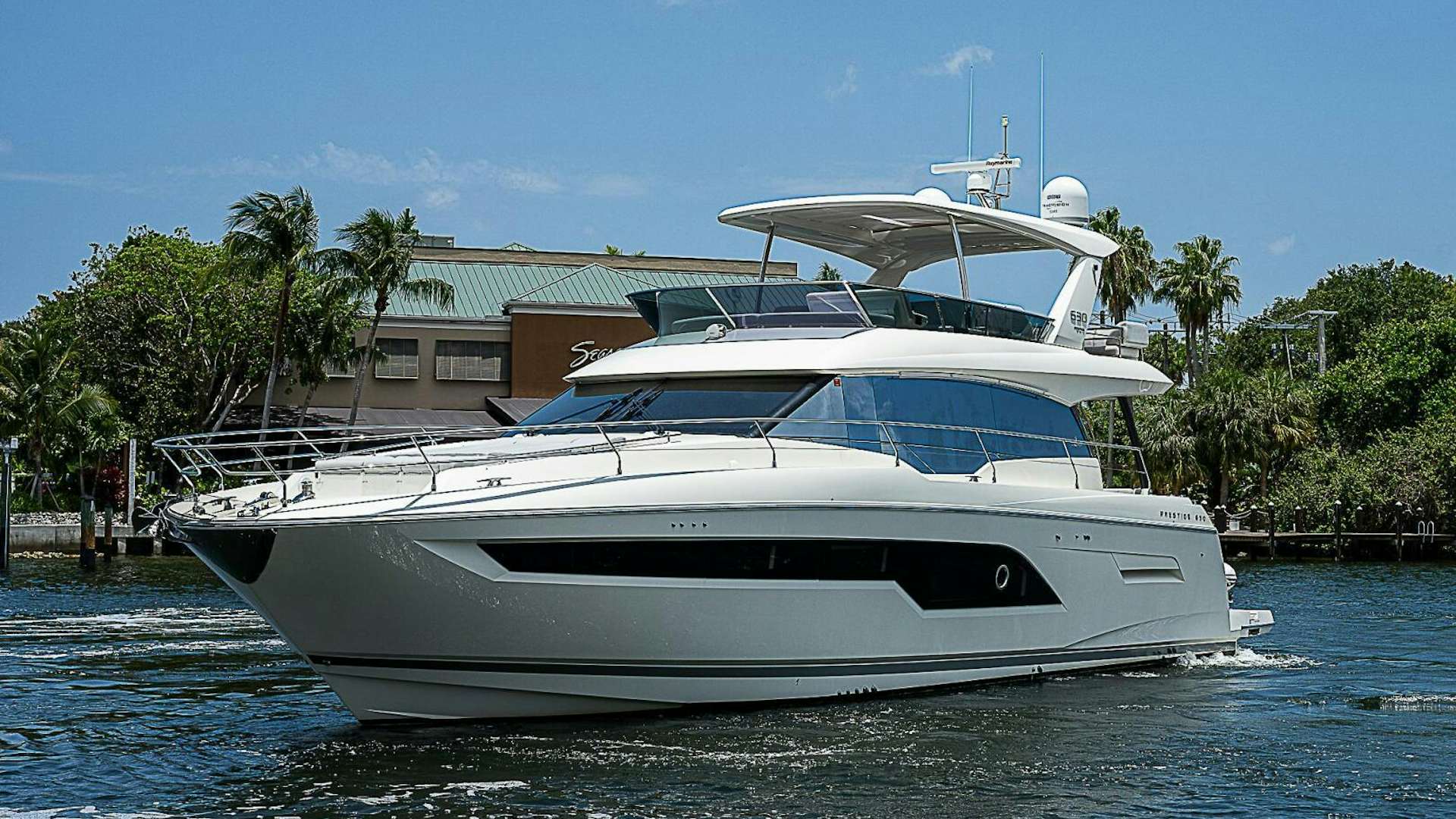 a white yacht on the water aboard 63' PRESTIGE  2020 Yacht for Sale