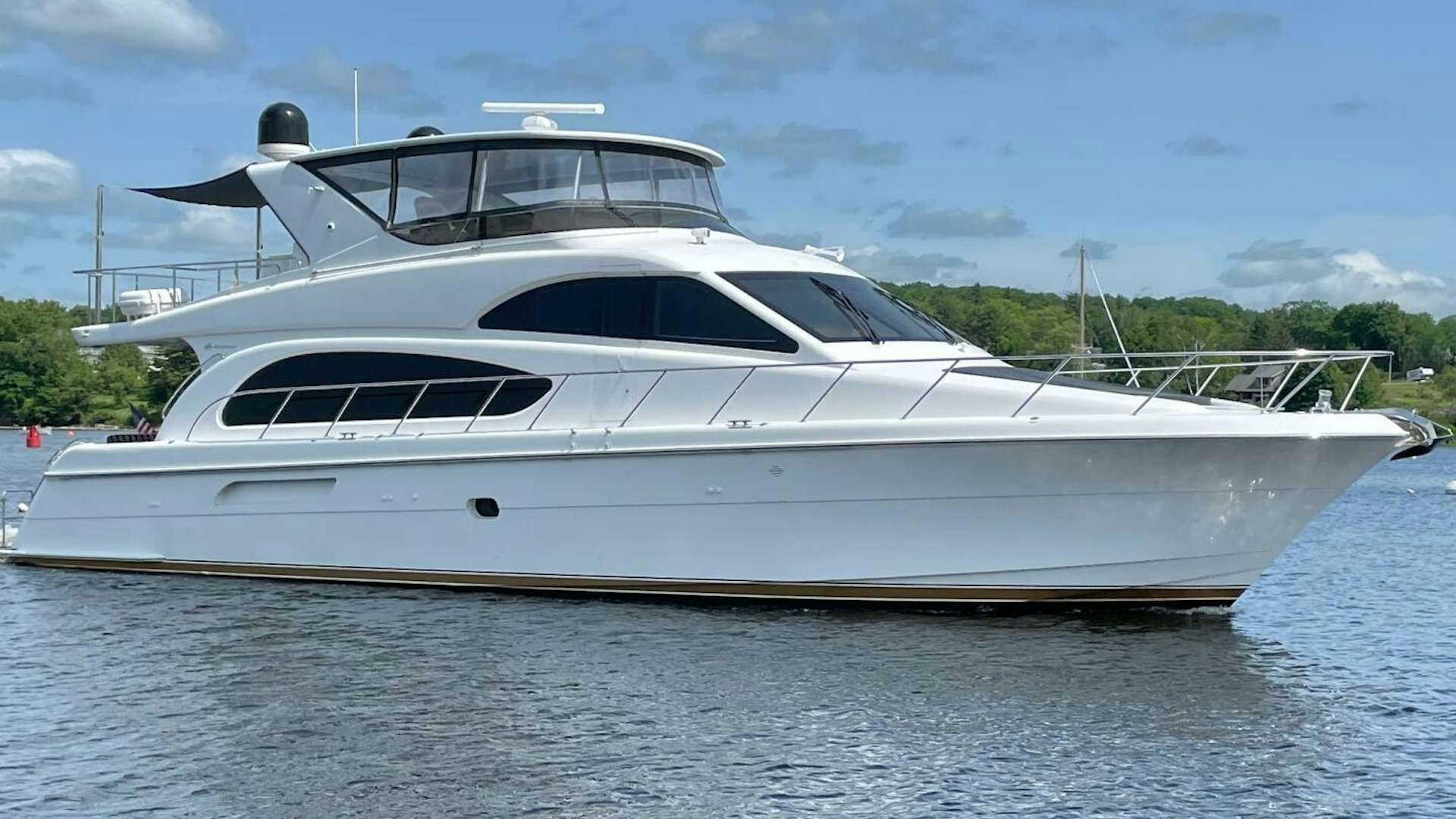 a white yacht on the water aboard RELENTLESS Yacht for Sale