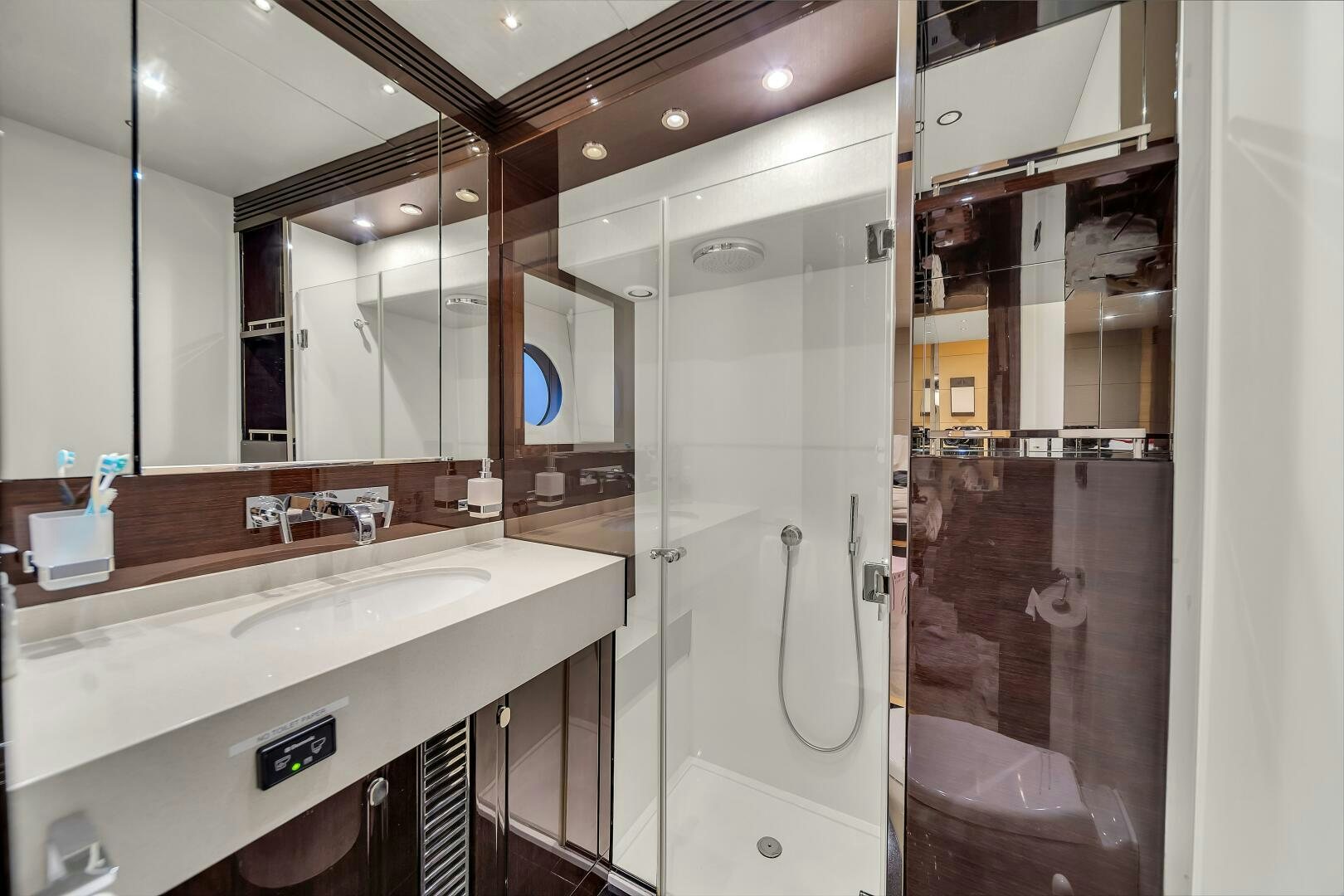 a bathroom with a shower and sink aboard GEM Yacht for Sale