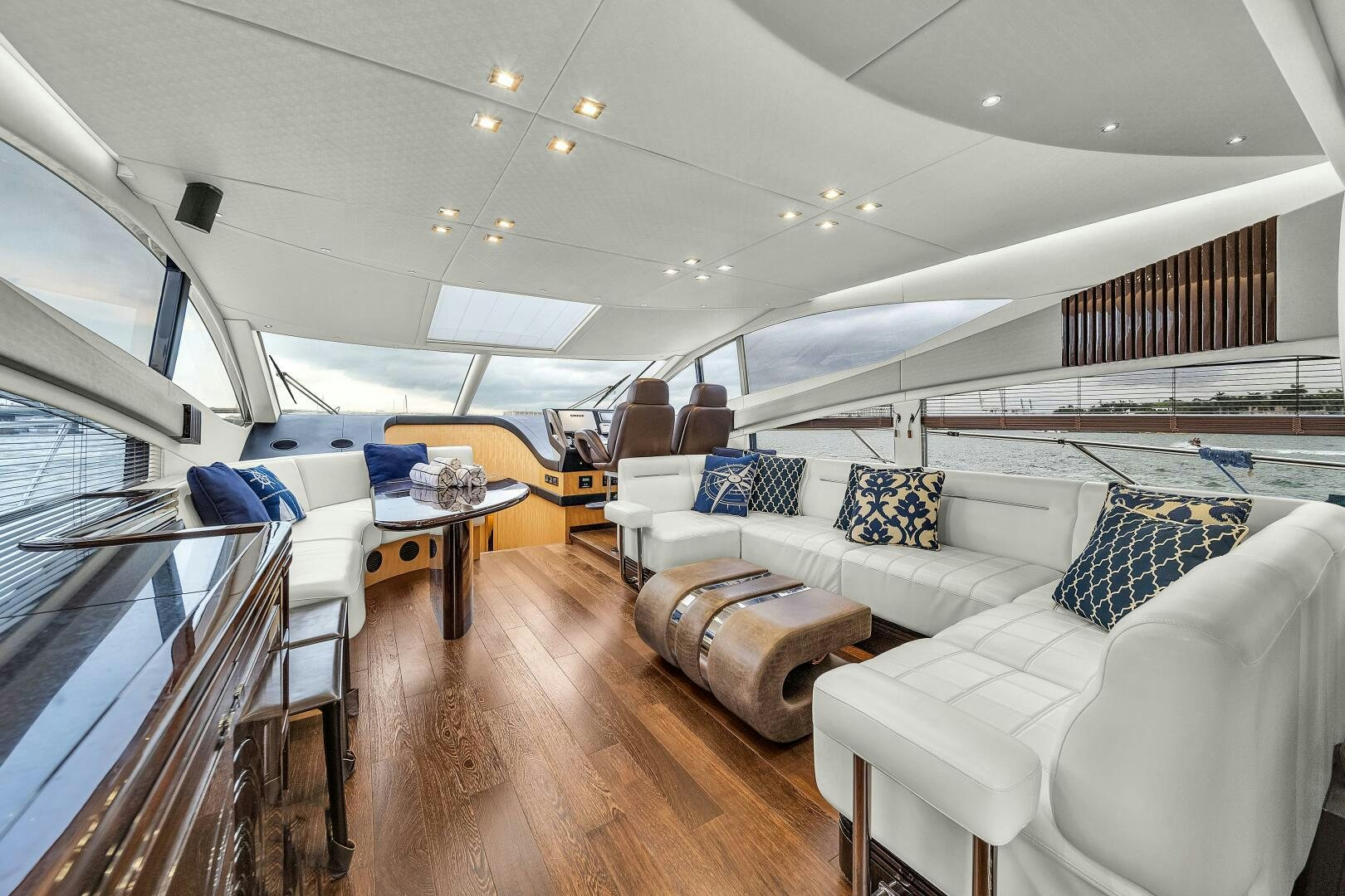 a room with a couch and a table aboard GEM Yacht for Sale