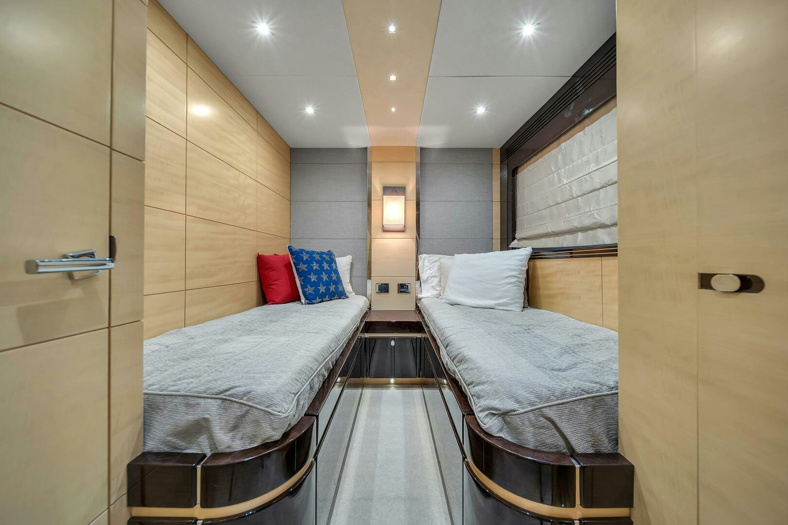 a room with a bed and a chair aboard GEM Yacht for Sale