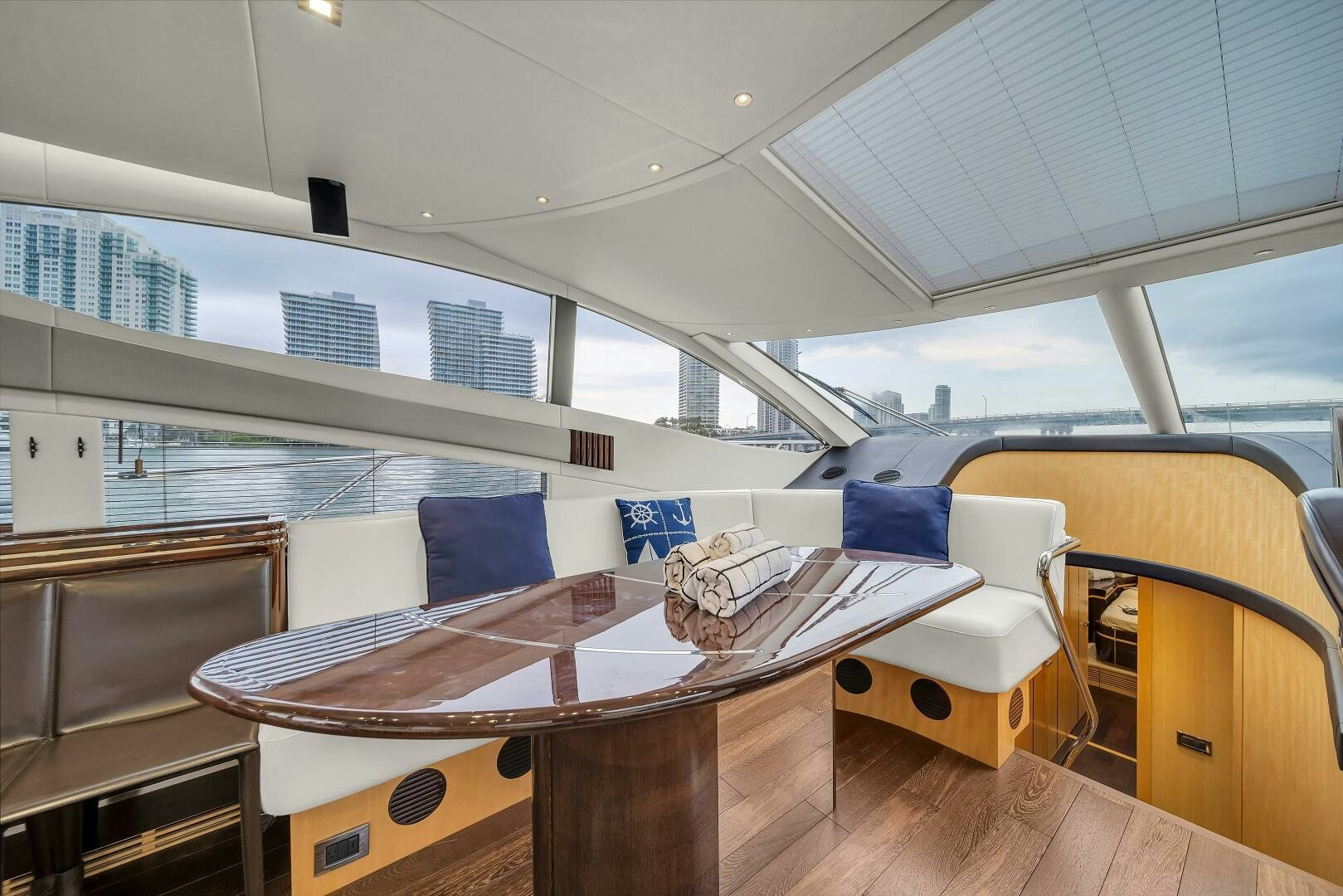 a table and chairs in a room aboard GEM Yacht for Sale