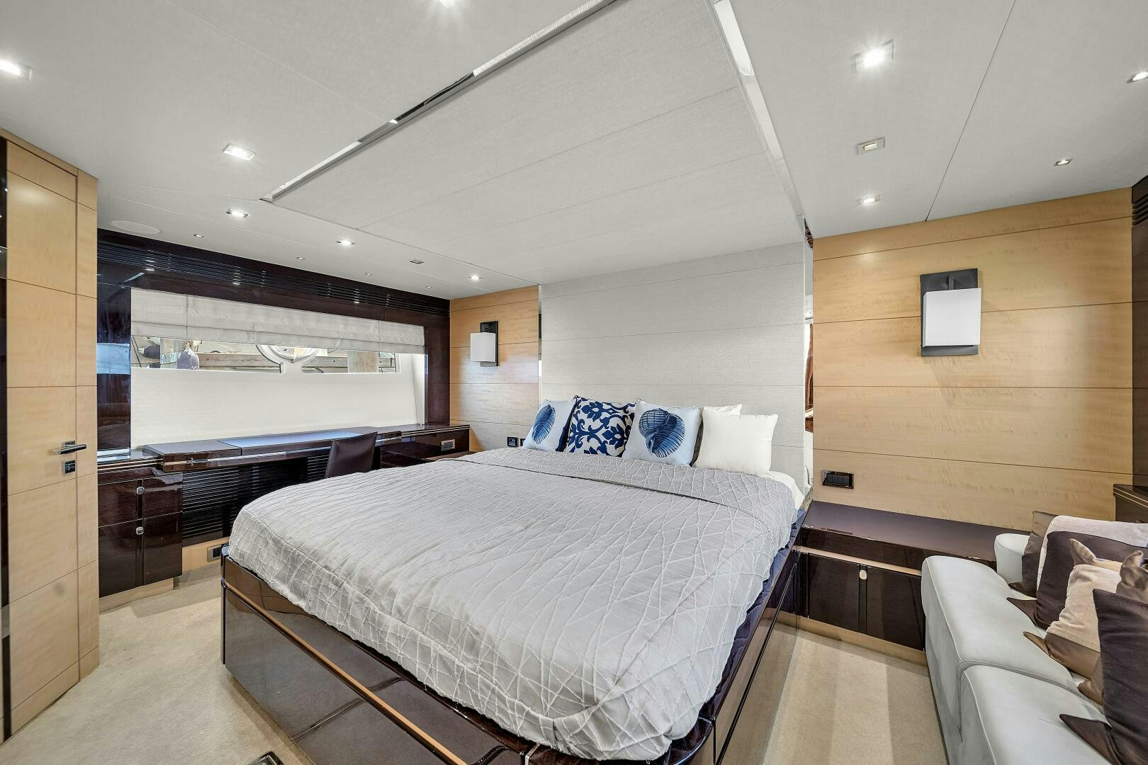 a large bedroom with a large bed aboard GEM Yacht for Sale