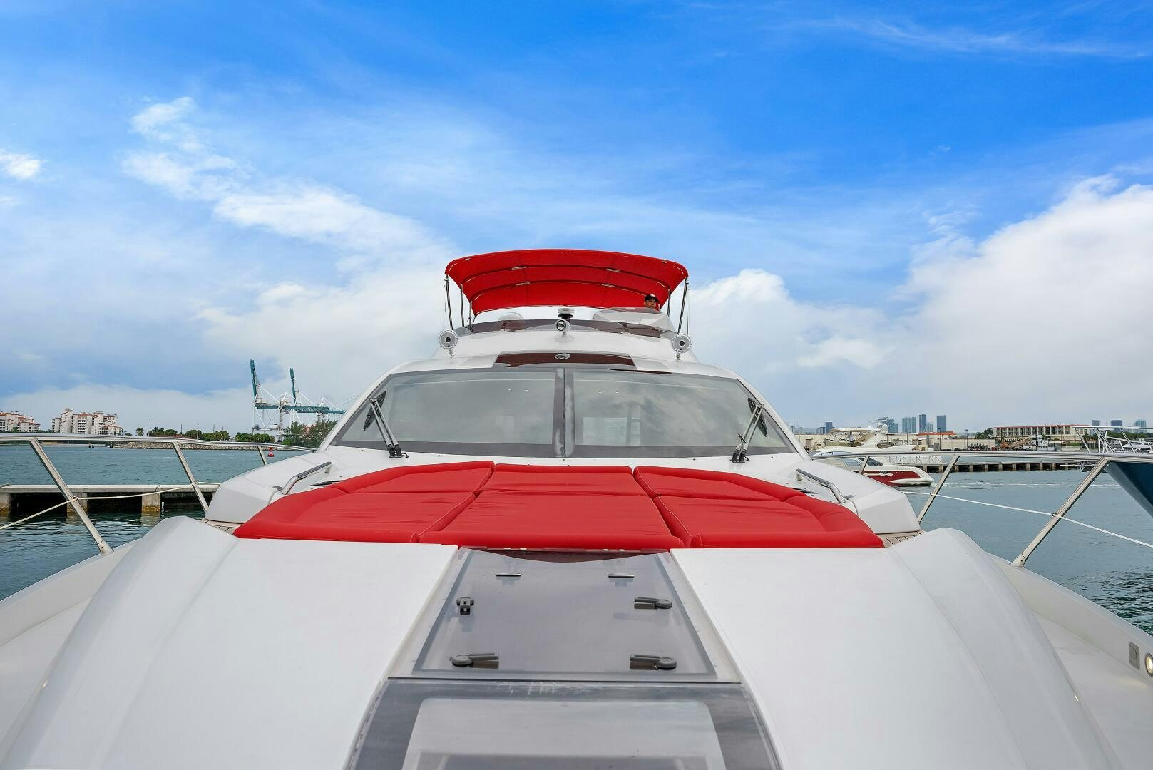 a white yacht with red trim aboard GEM Yacht for Sale