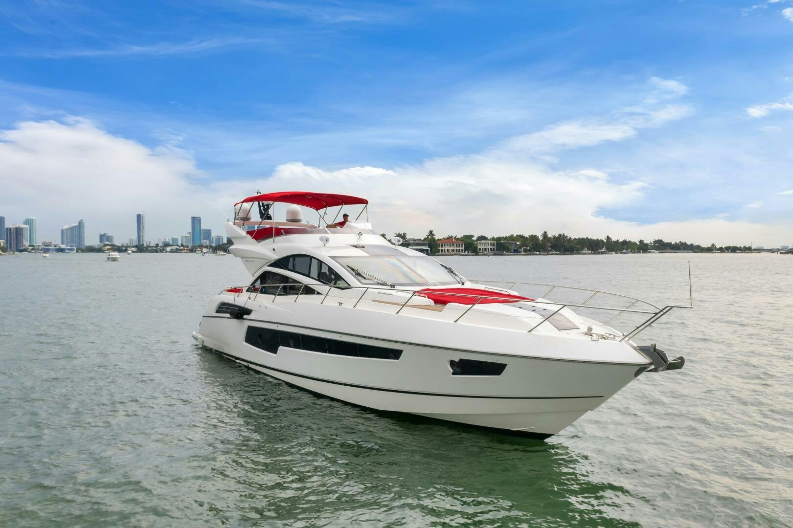 a white yacht in the water aboard GEM Yacht for Sale