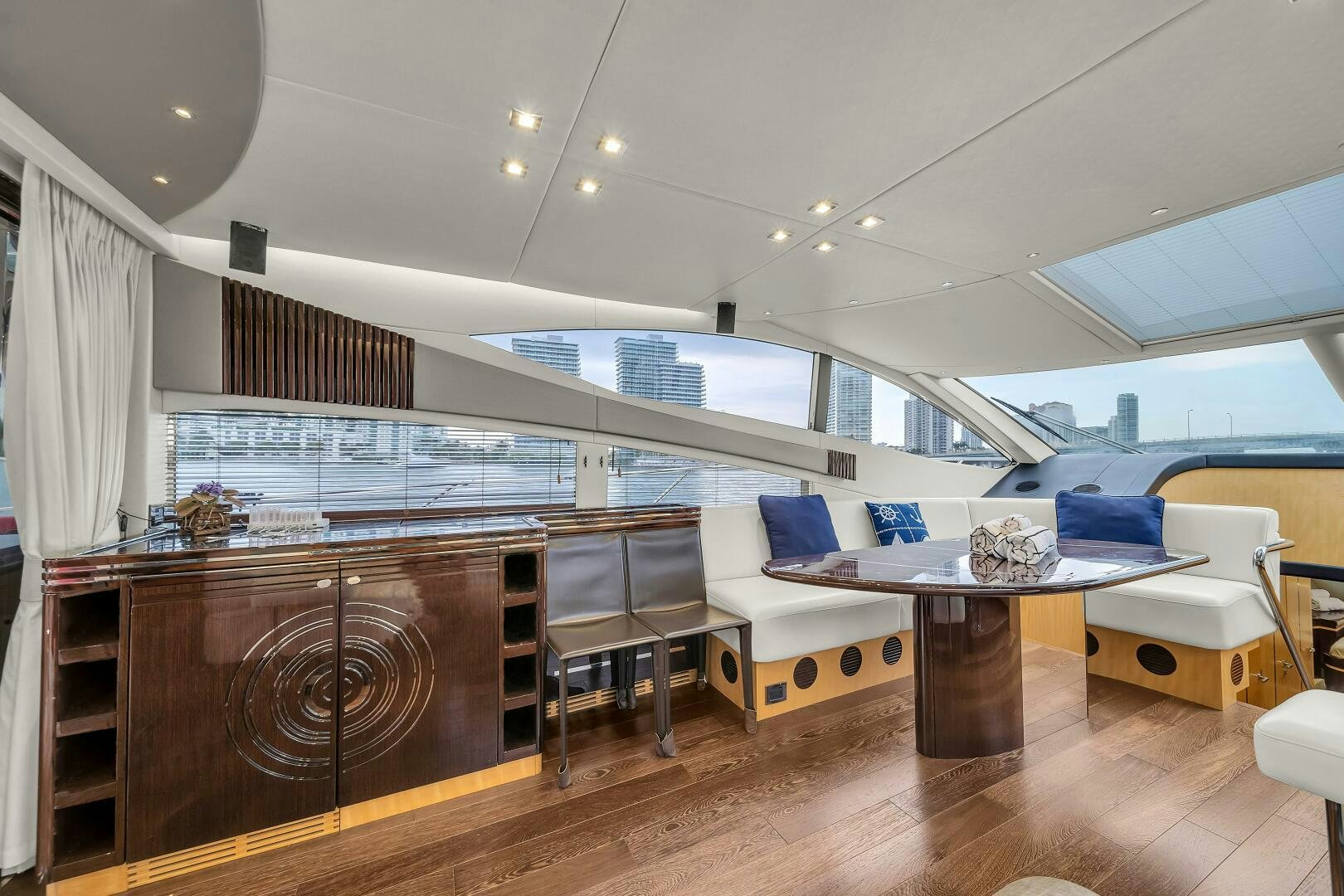 a room with a table and chairs aboard GEM Yacht for Sale