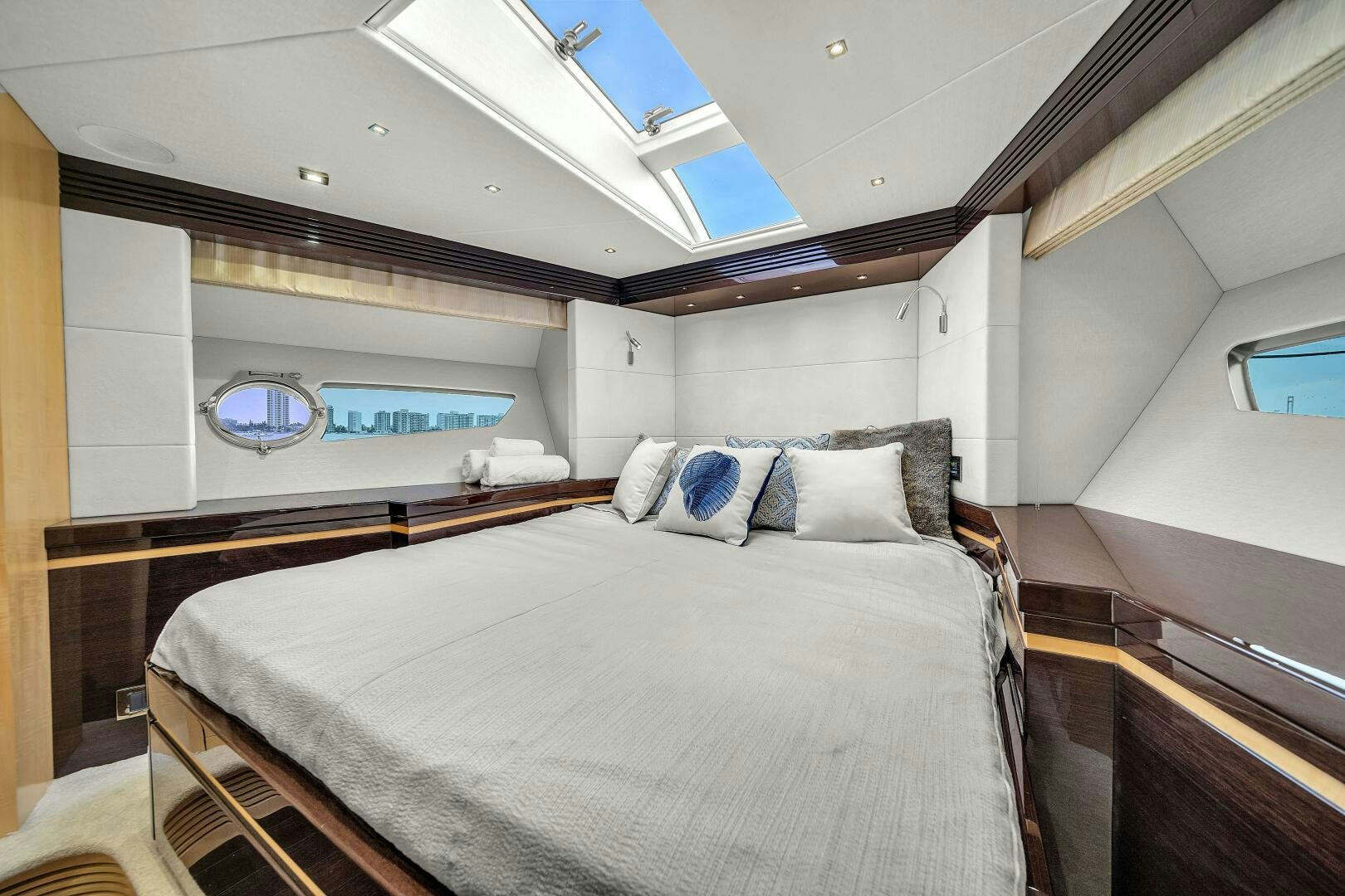 a room with a bed and a window aboard GEM Yacht for Sale