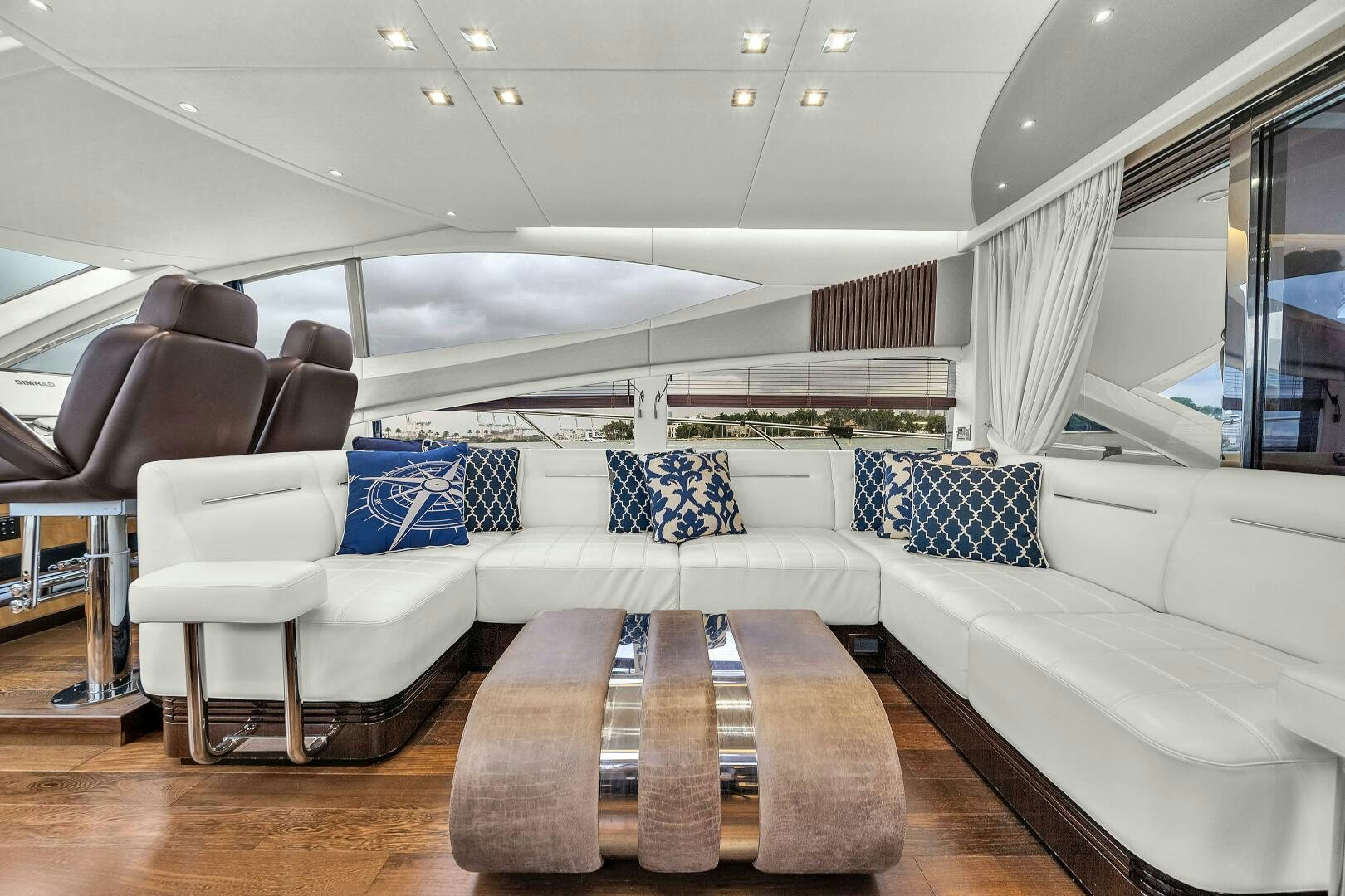 a room with couches and a table aboard GEM Yacht for Sale