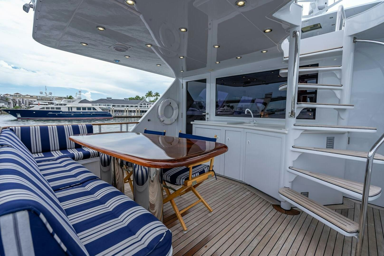 a boat with a table and chairs aboard MY WAY Yacht for Sale