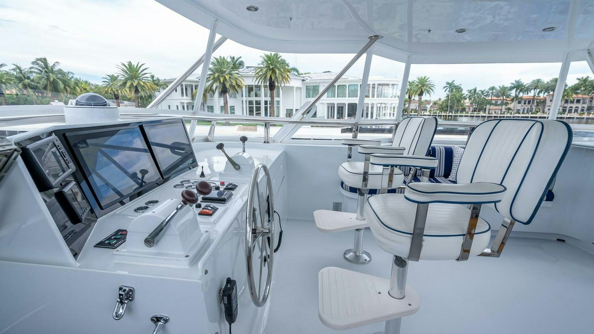 a white yacht with white chairs aboard MY WAY Yacht for Sale