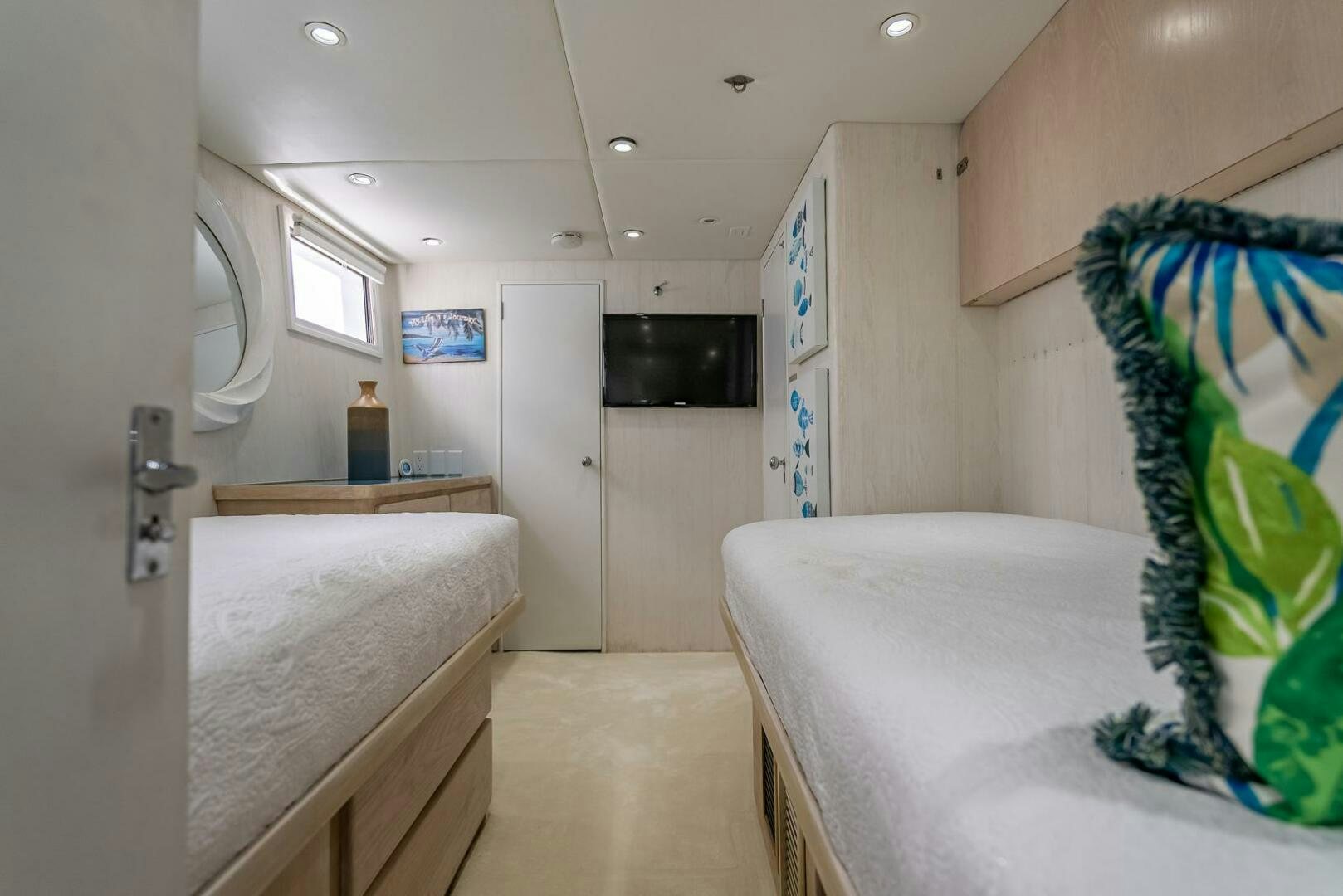 a room with a bed and a television aboard MY WAY Yacht for Sale