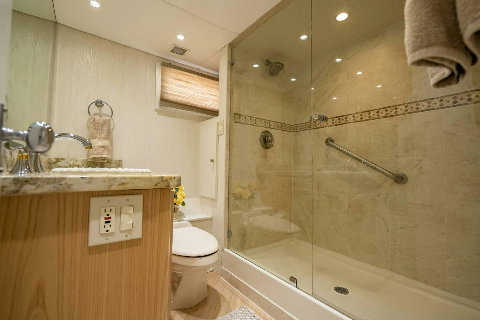 a bathroom with a glass shower aboard MY WAY Yacht for Sale