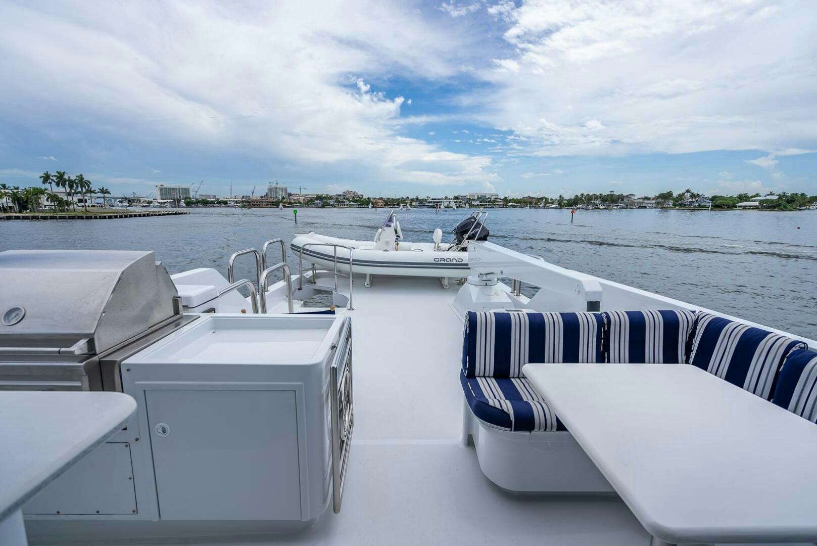 a boat with a deck and a deck with chairs on it aboard MY WAY Yacht for Sale