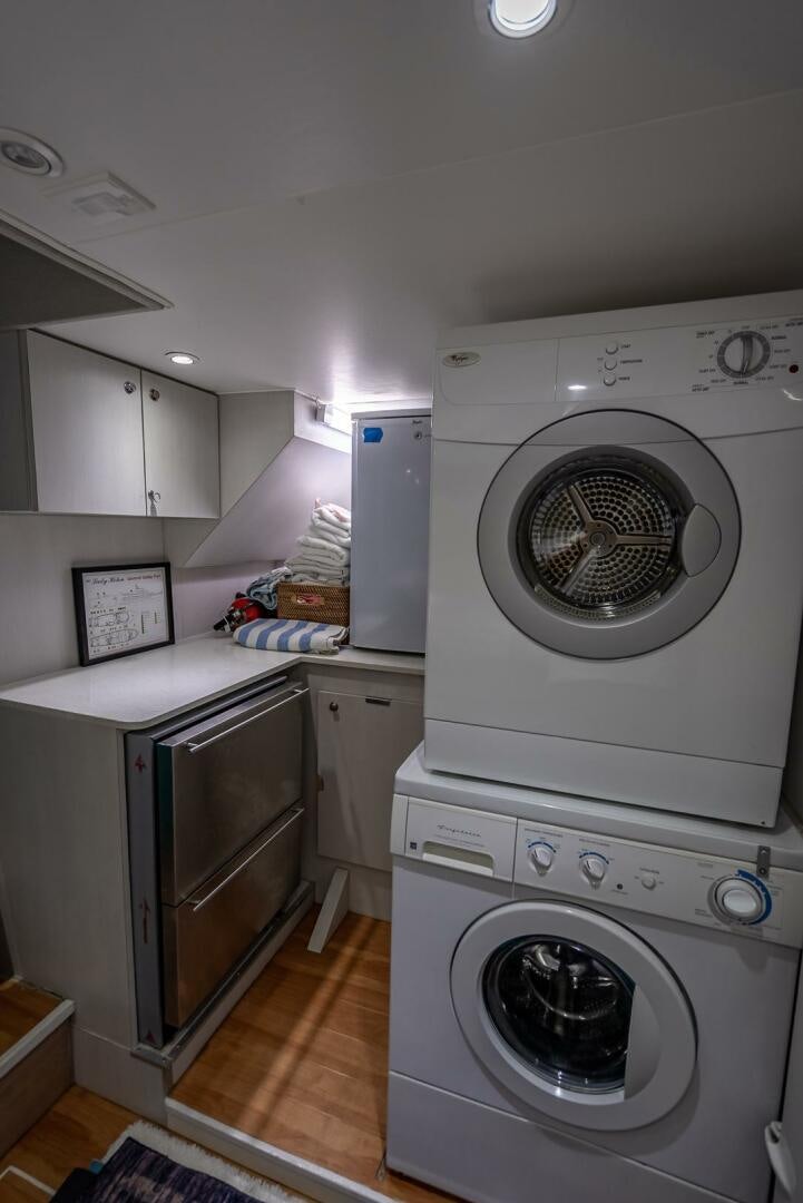 a laundry room with a washing machine aboard MY WAY Yacht for Sale