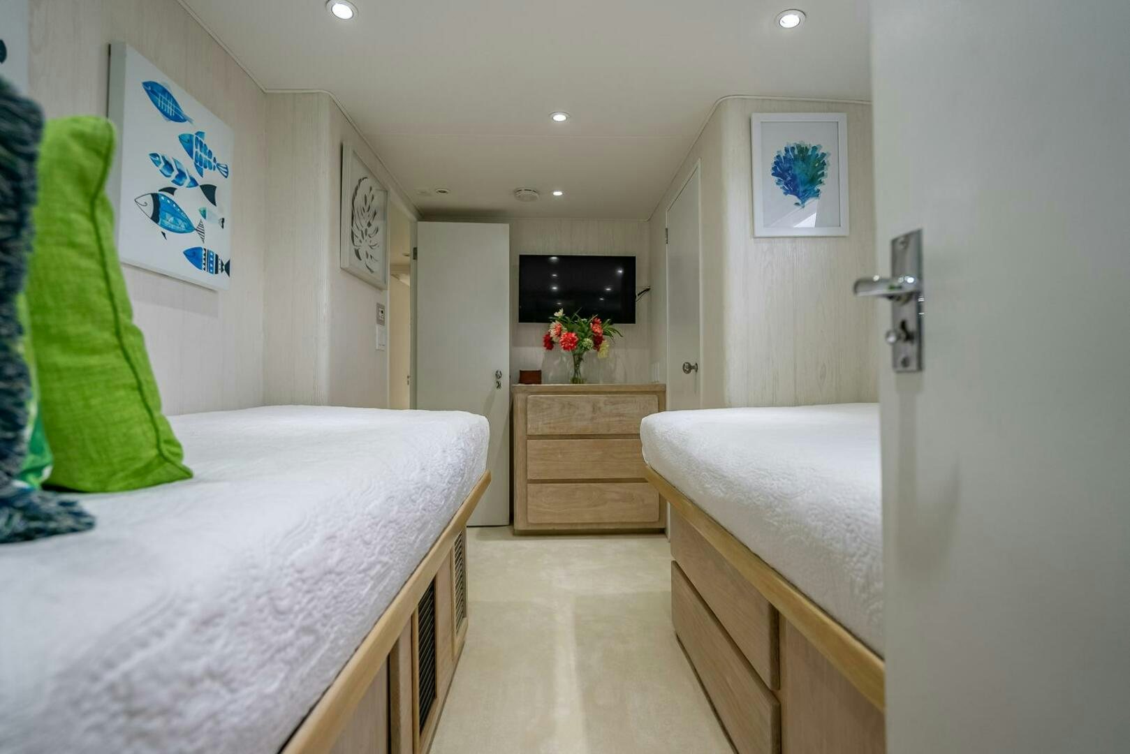 a bedroom with a bed and a dresser aboard MY WAY Yacht for Sale