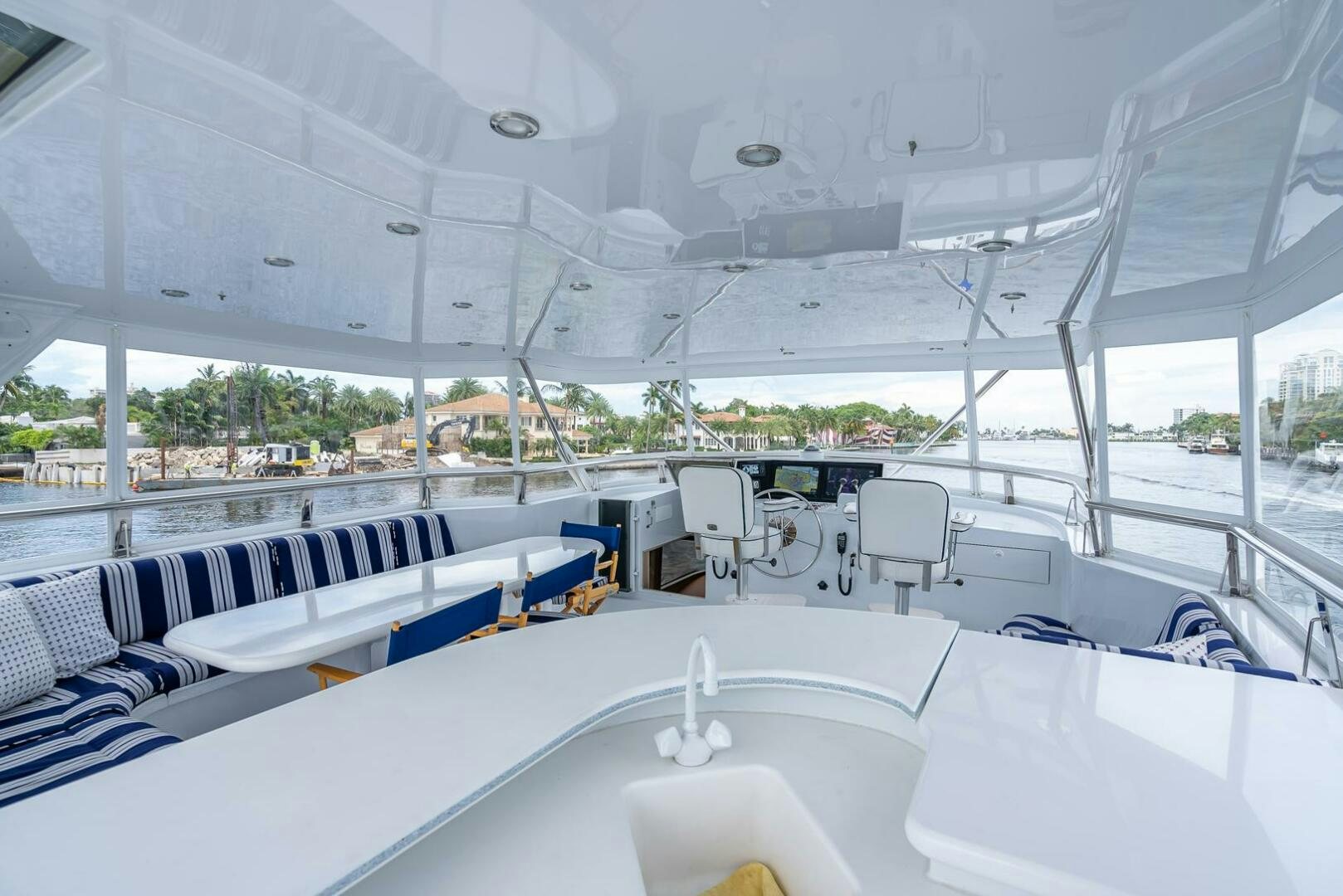 a room with white tables and chairs aboard MY WAY Yacht for Sale