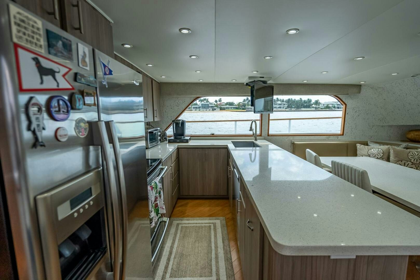 a kitchen with a large refrigerator aboard MY WAY Yacht for Sale