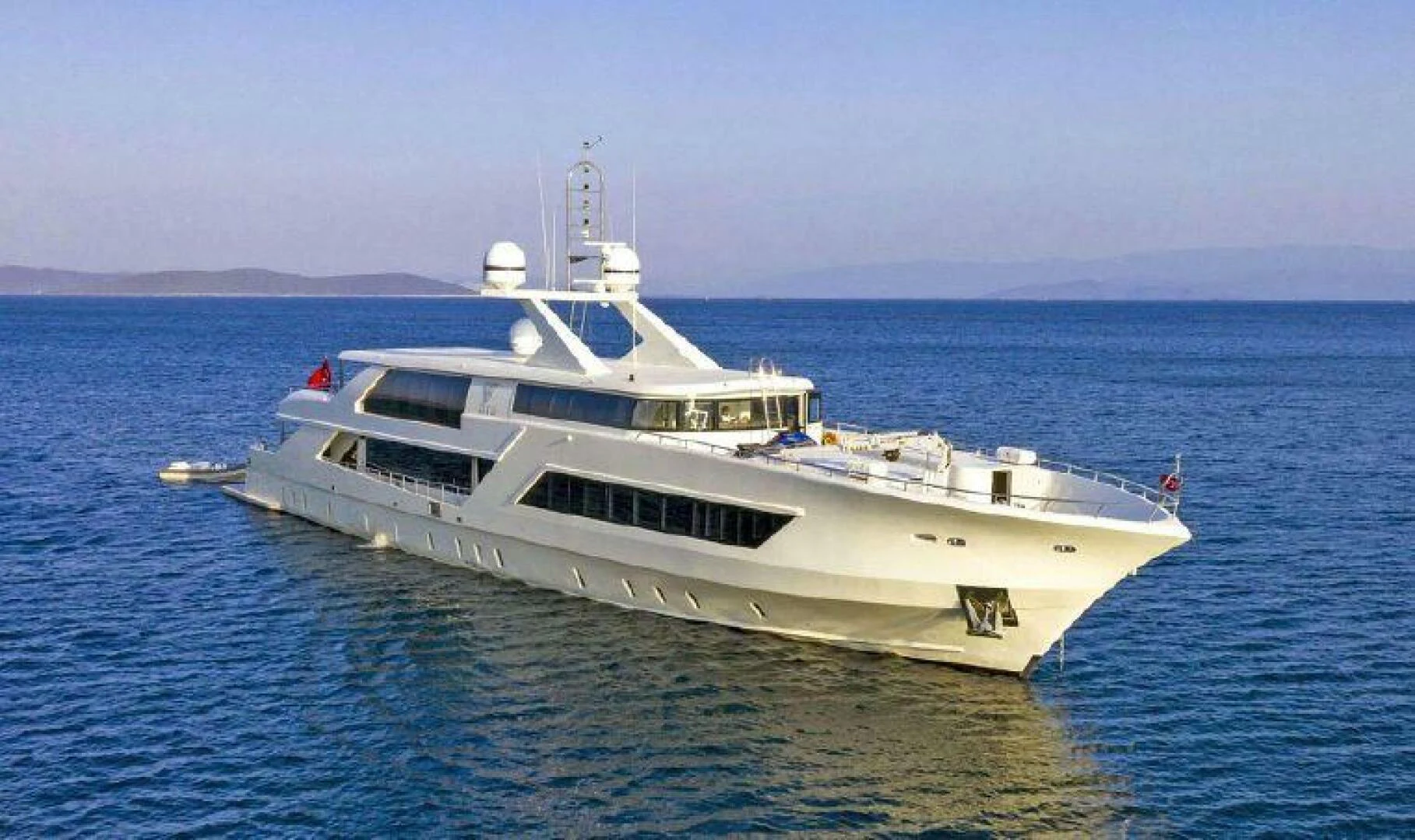 a white yacht in the water aboard VETRO Yacht for Sale