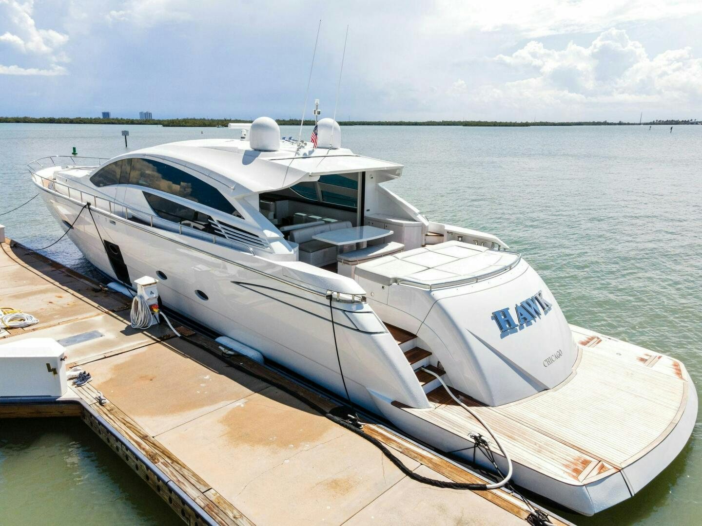 a boat docked at a pier aboard HAWK Yacht for Sale
