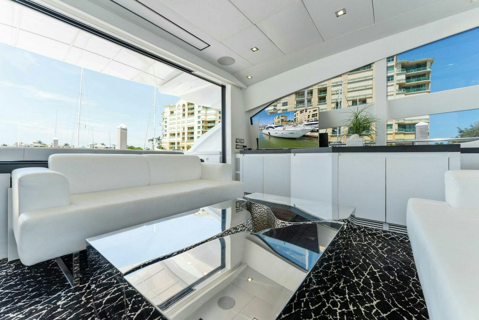 a room with a table and chairs aboard HAWK Yacht for Sale