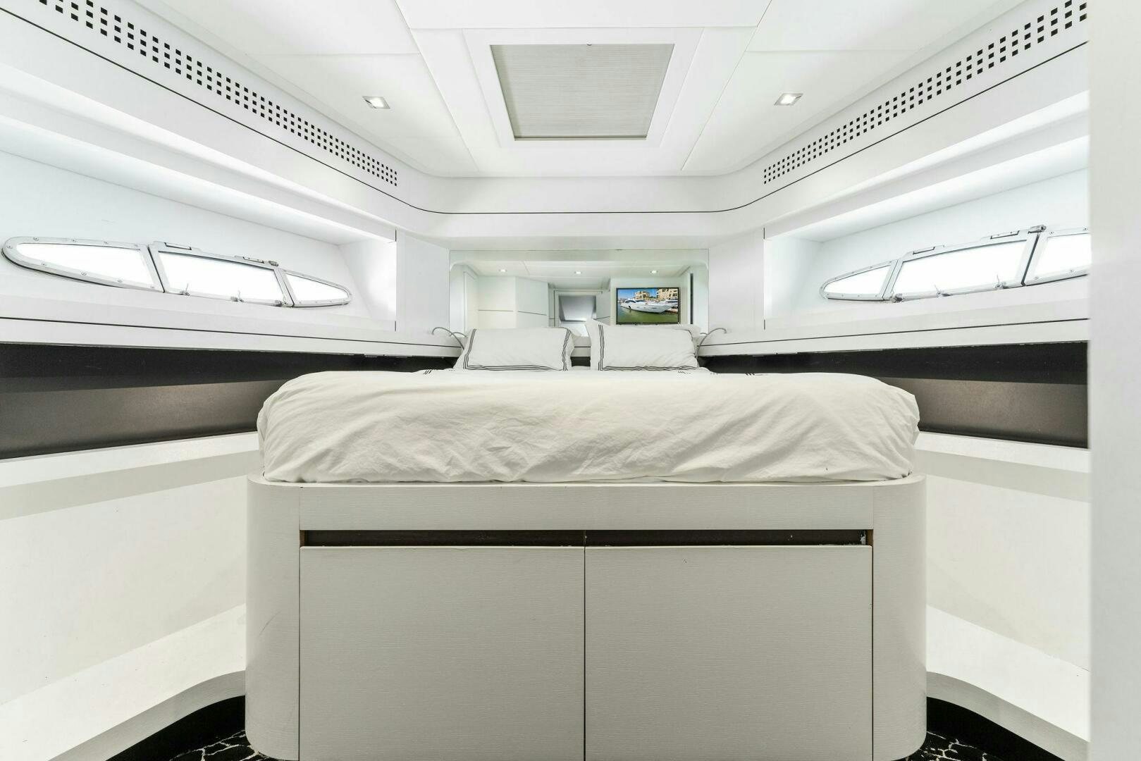 a white room with a bed aboard HAWK Yacht for Sale