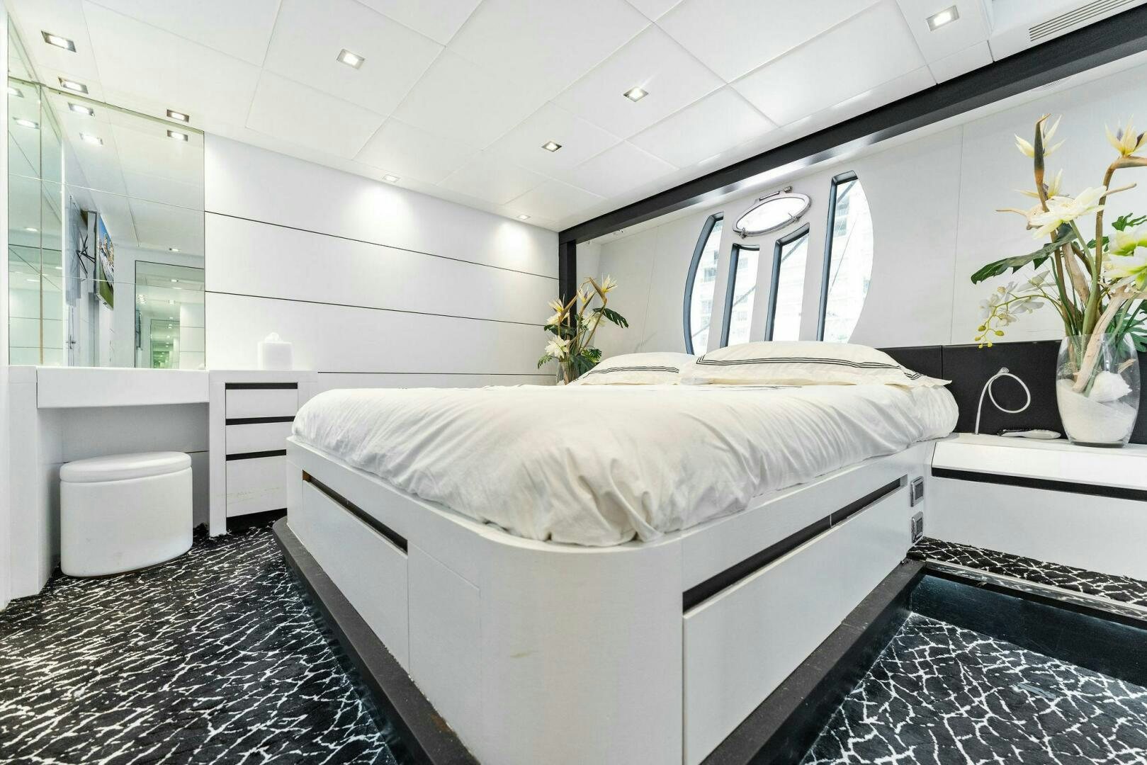 a white bed in a room aboard HAWK Yacht for Sale