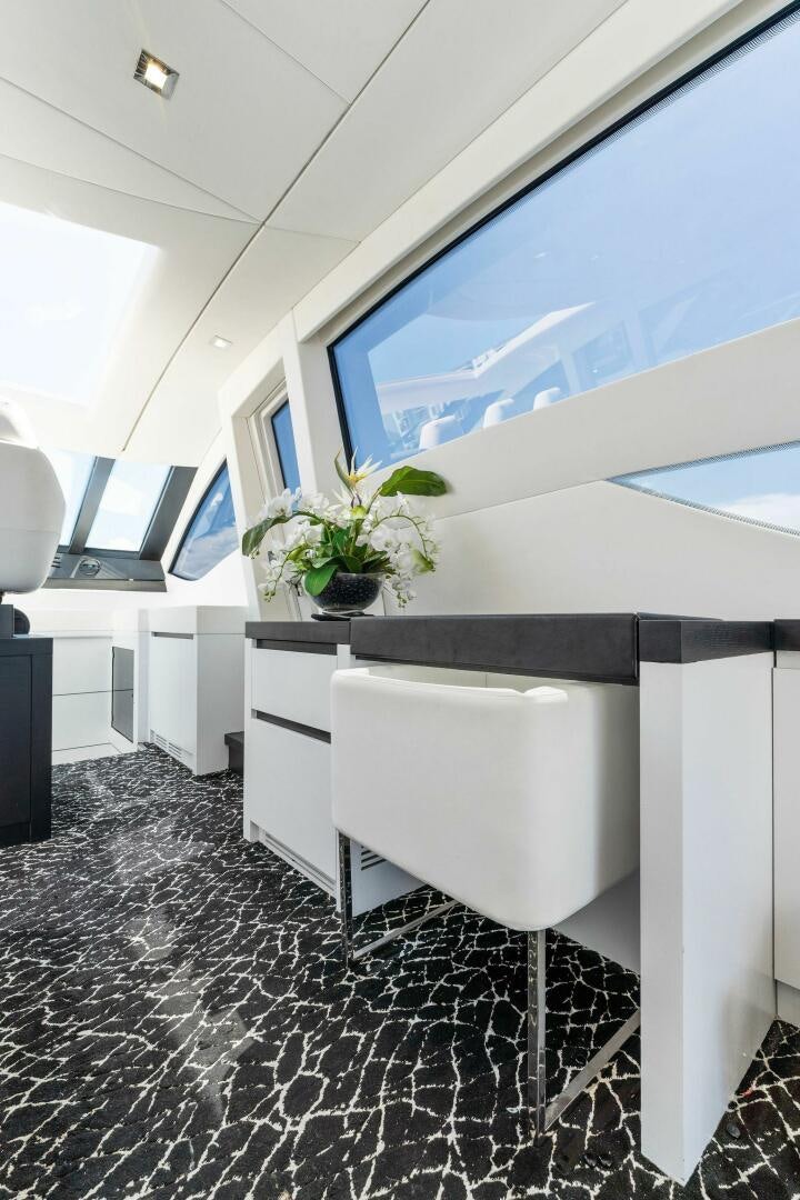 a white chair in a room aboard HAWK Yacht for Sale