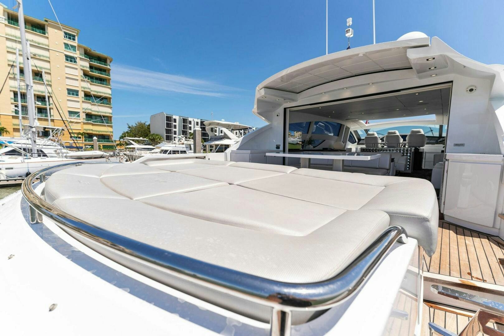 a white boat on a dock aboard HAWK Yacht for Sale