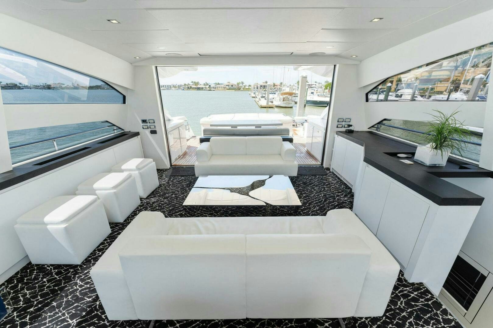 a room with a large window and a large white sofa aboard HAWK Yacht for Sale