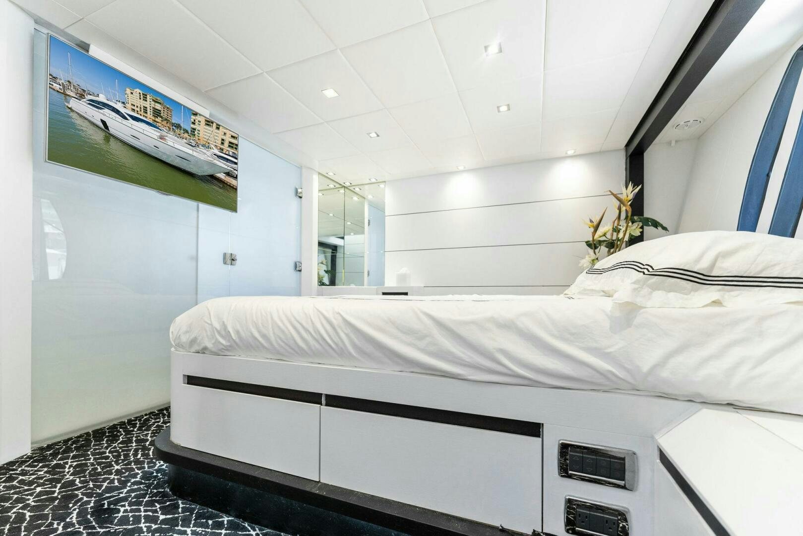 a white bed in a room aboard HAWK Yacht for Sale