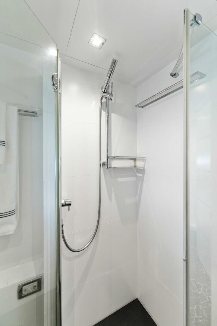 a bathroom with a shower unit aboard HAWK Yacht for Sale