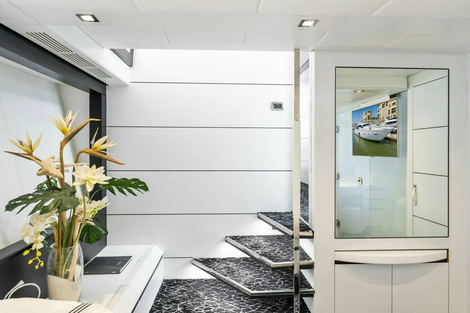 a room with a desk and a computer aboard HAWK Yacht for Sale