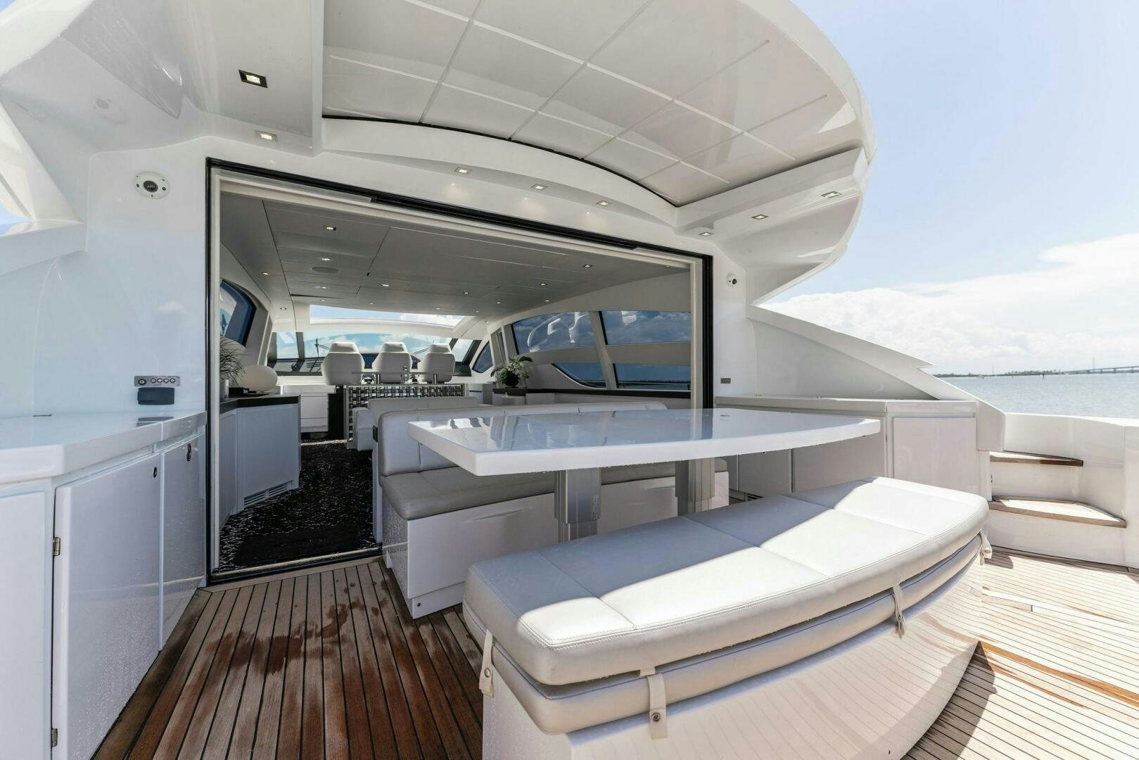 a room with a large white table and a large window aboard HAWK Yacht for Sale