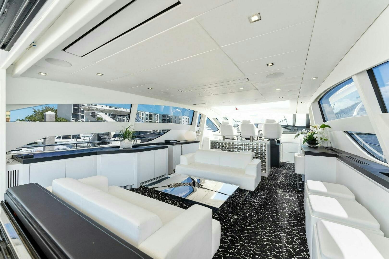 a room with a large window and a view of the ocean aboard HAWK Yacht for Sale