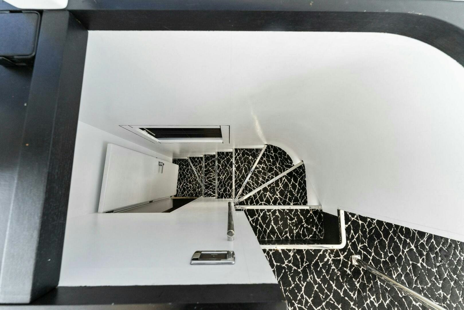 a black and white photo of a building aboard HAWK Yacht for Sale