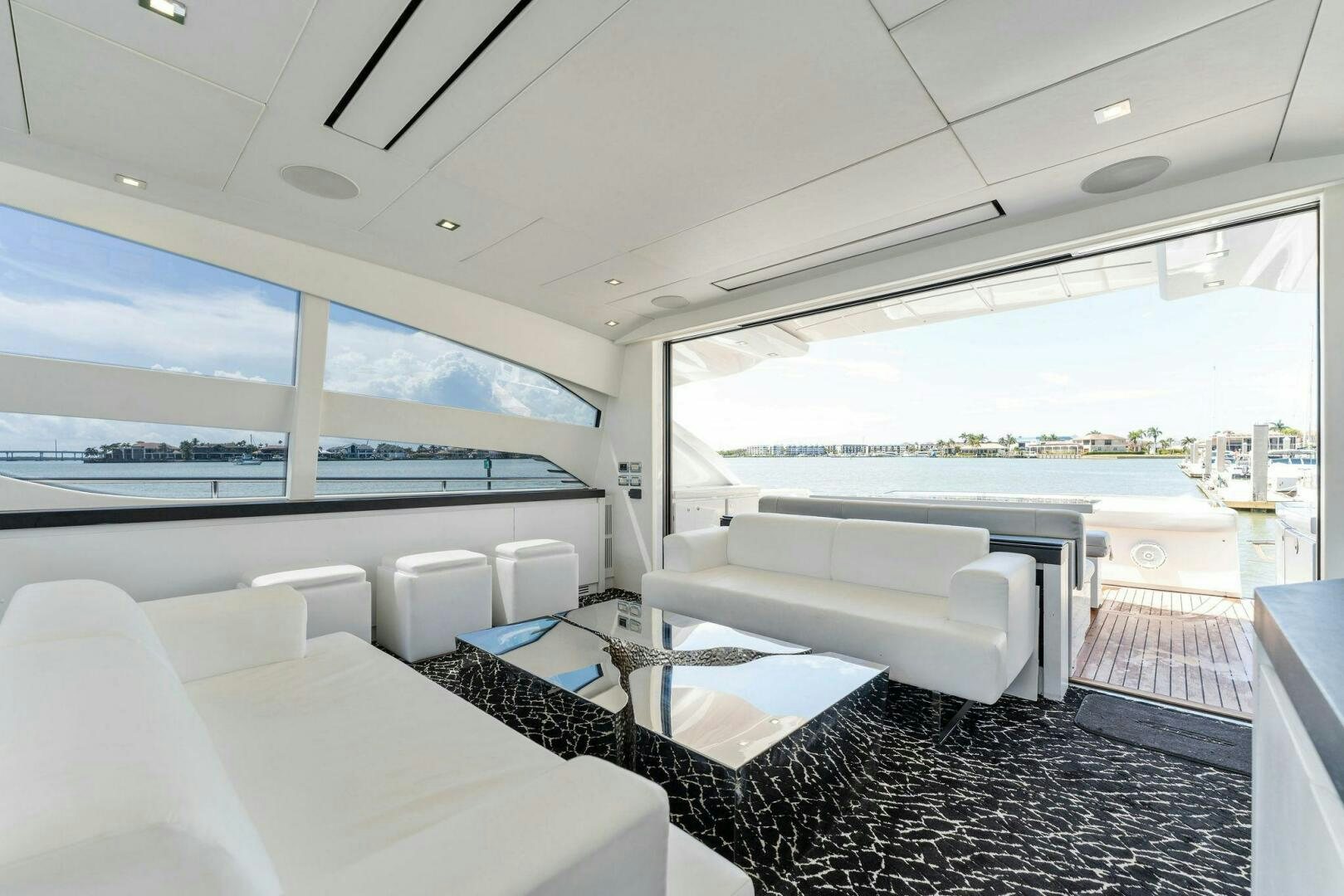 a room with a large window and a view of the ocean aboard HAWK Yacht for Sale